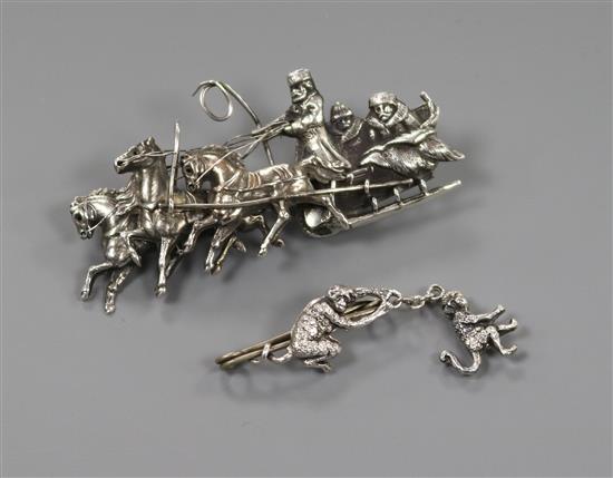 A late 19th century Russian 84 zolotnik troika brooch (a.f.) and a white metal hanging monkey brooch. Troika 61mm.
